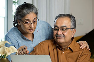 Couple reading about Social Security Administration and Medicare benefits